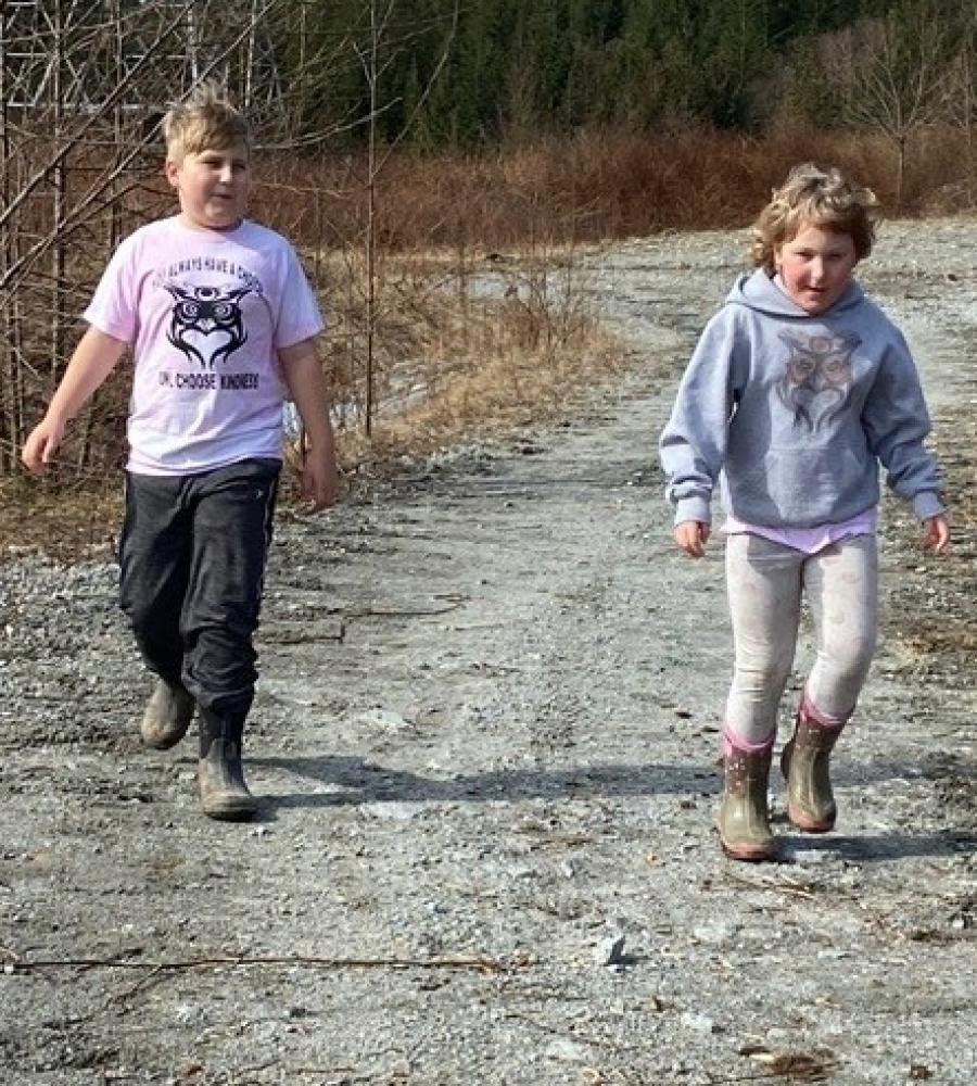 Kid walking on road
